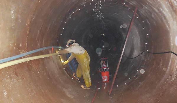 Workers performing tunnel rehabilitation