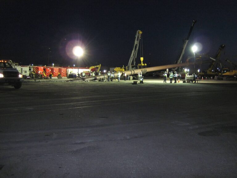 Workers at night installing new water line for Elizabeth River Crossing