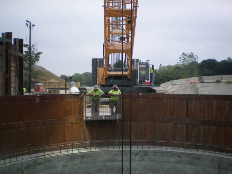 Construction crew inspecting shaft at South Cobb Tunnel