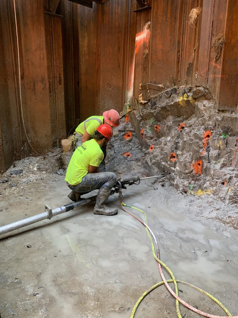 Drilling in sandstone for Drill and Blast tunneling beneath railroad in Dover, NH- Brierley Associates