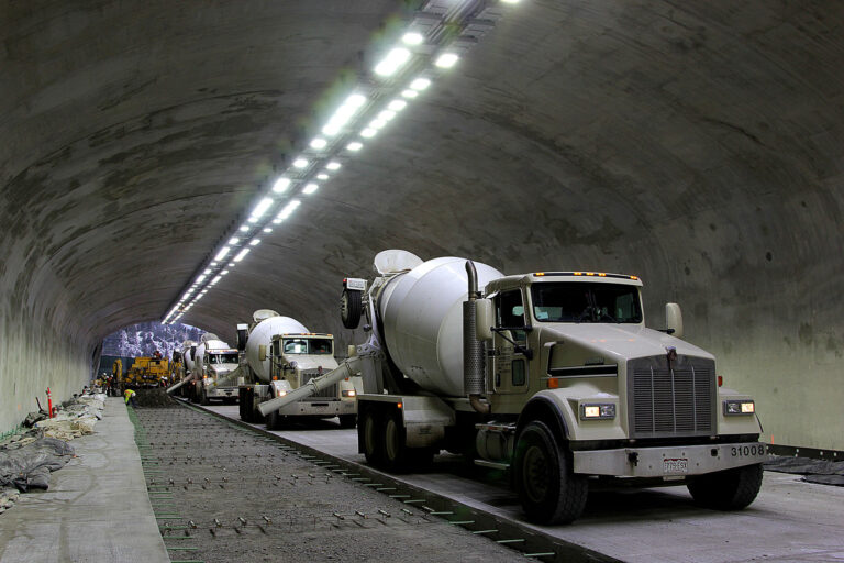Concrete trucks lined up for pour in tunnel
